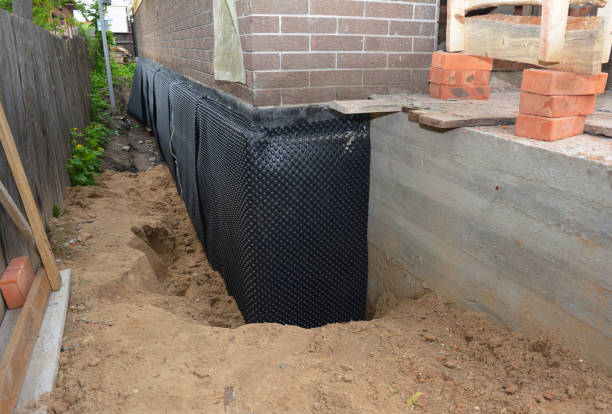 Happy homeowners after waterproofing job in Oneida